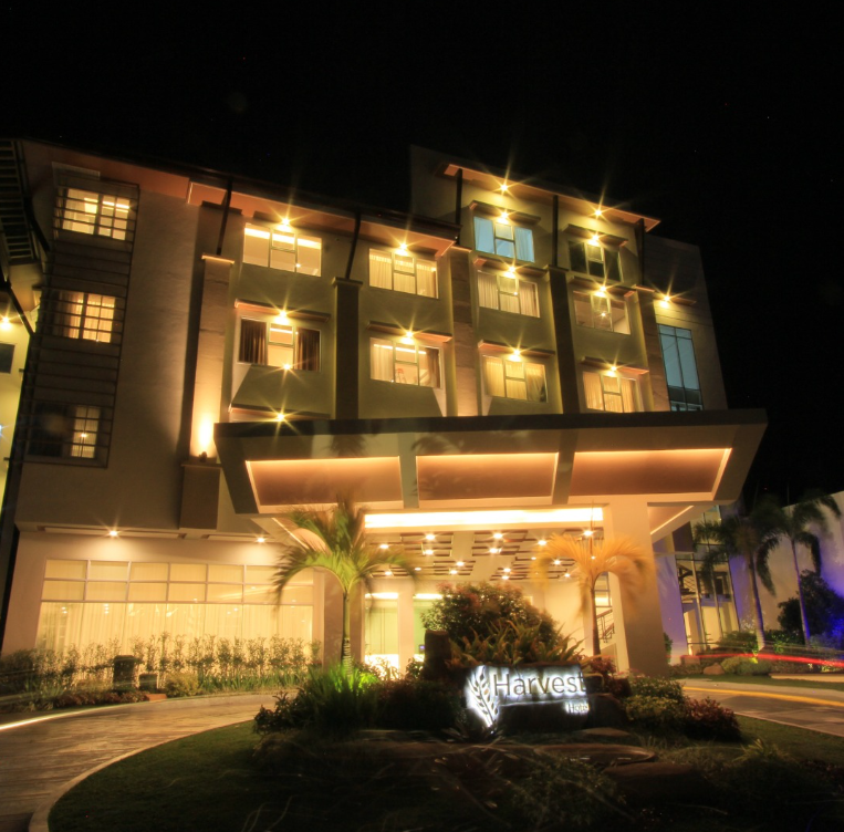 Harvest Hotel Cabanatuan City Philippines illuminated facade at night
