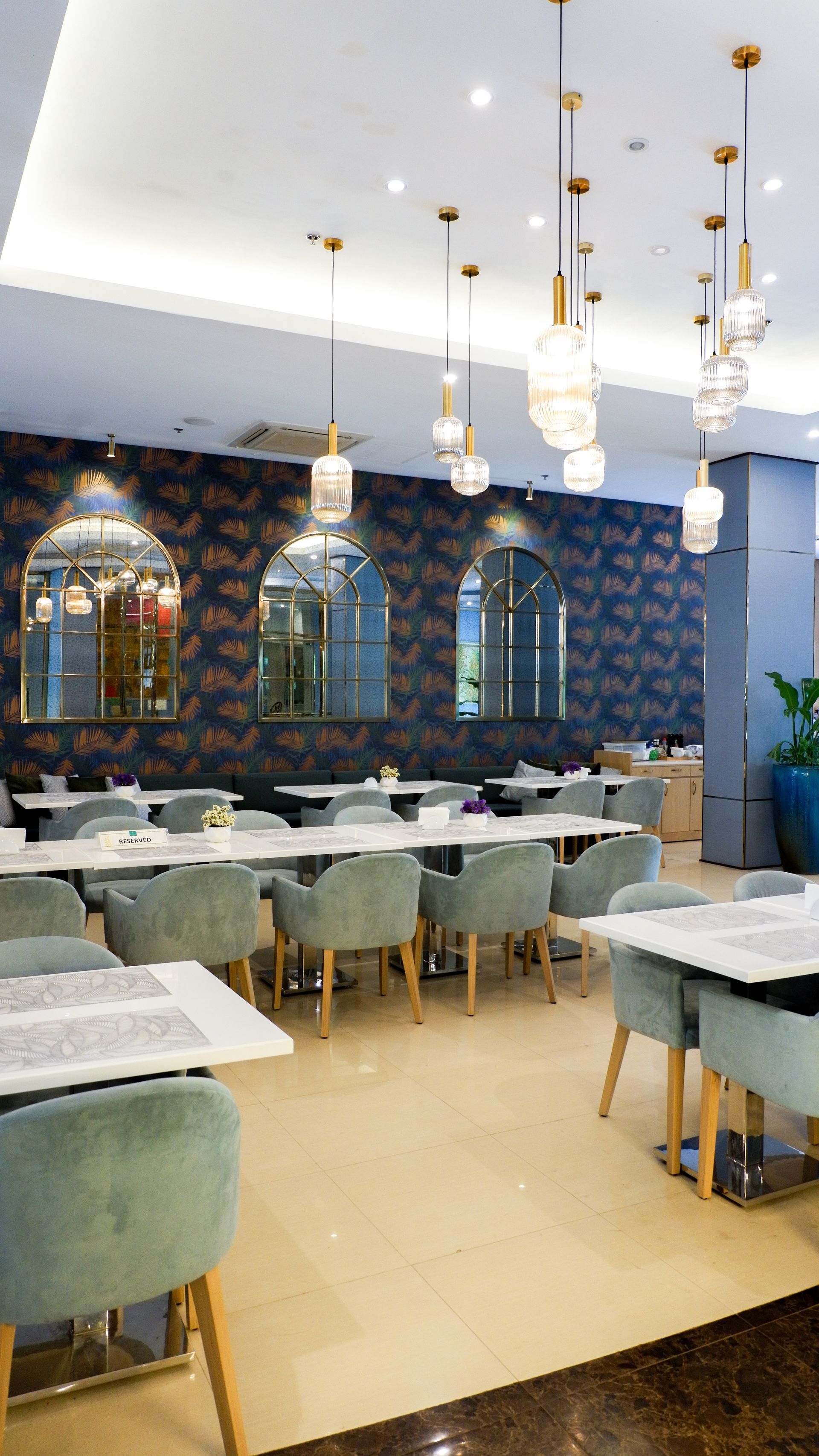Elegant Cafe Ecija dining area at Harvest Hotel Cabanatuan with velvet chai