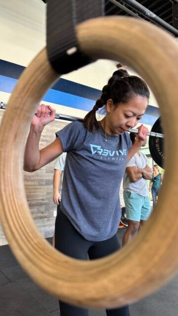 A member setting up to perform a back squat.