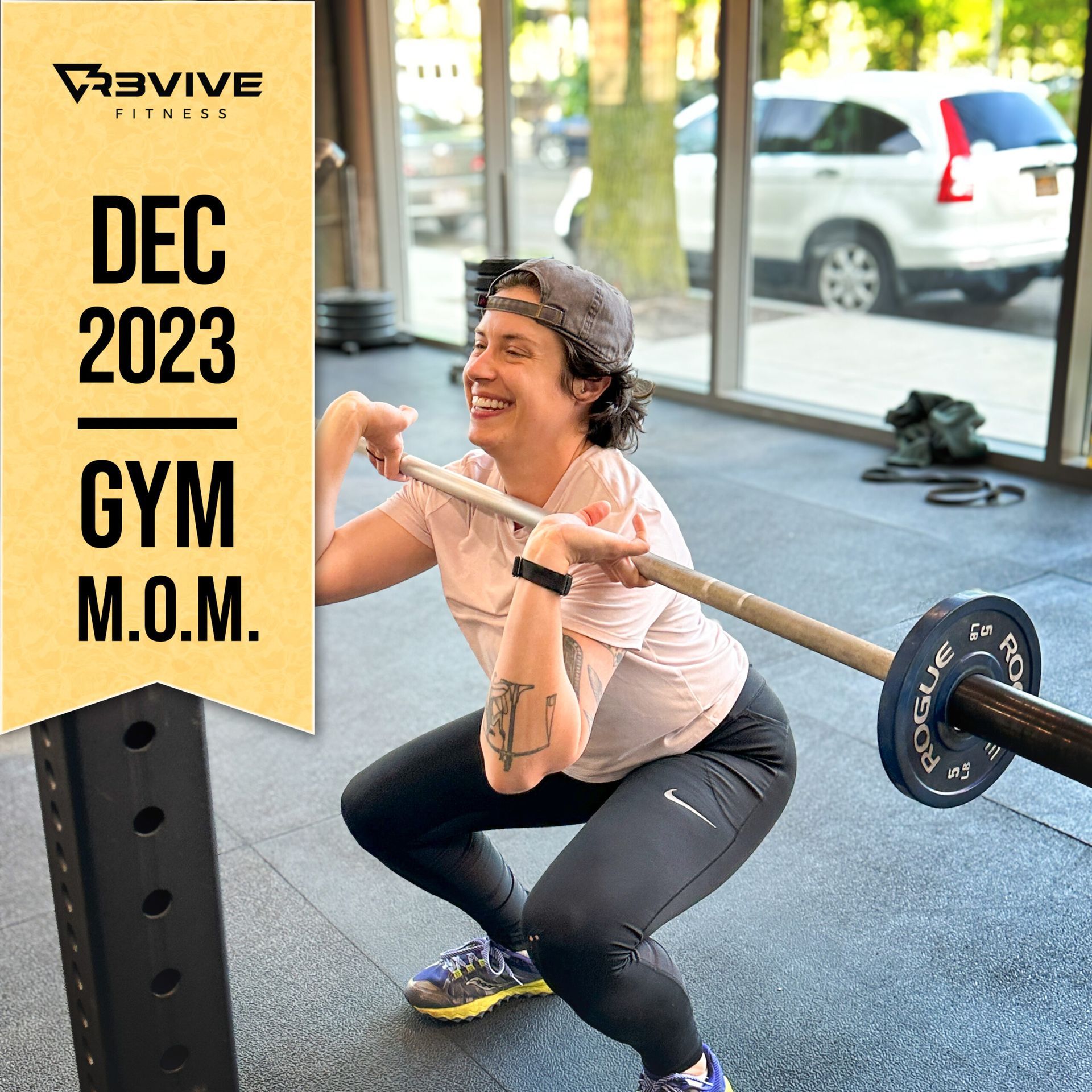 Woman in gym squatting with barbell, smiling. Text 