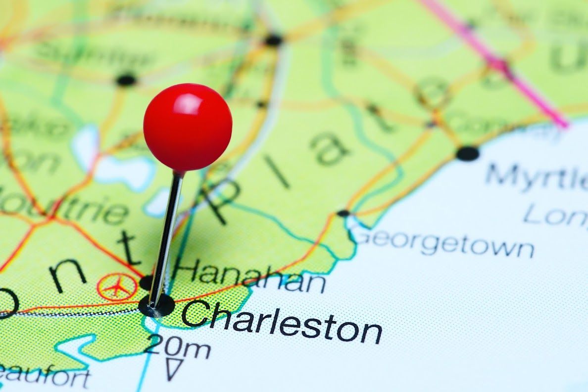A red pin is pinned to a map of charleston