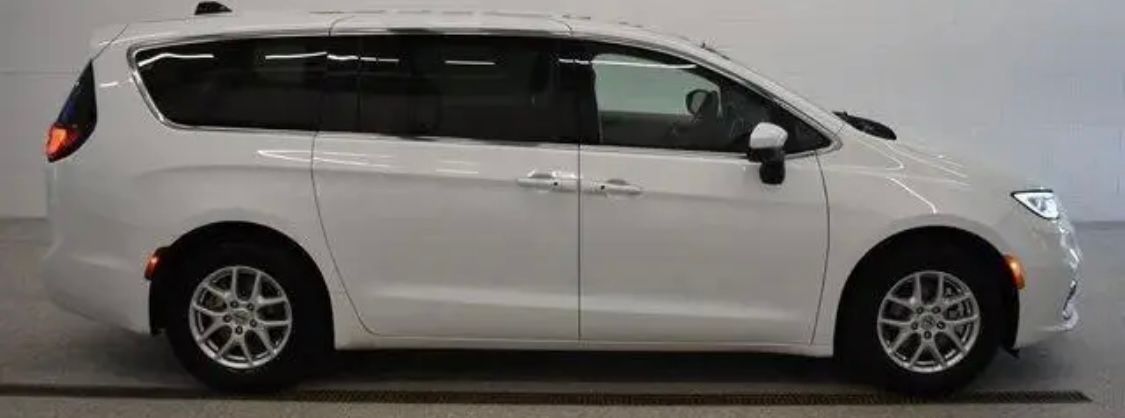 A white Chrysler Pacifica minivan shown from a side profile against a plain background.