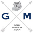 Logo: Gray arrows crossing with a house held in a hand; letters G and M;