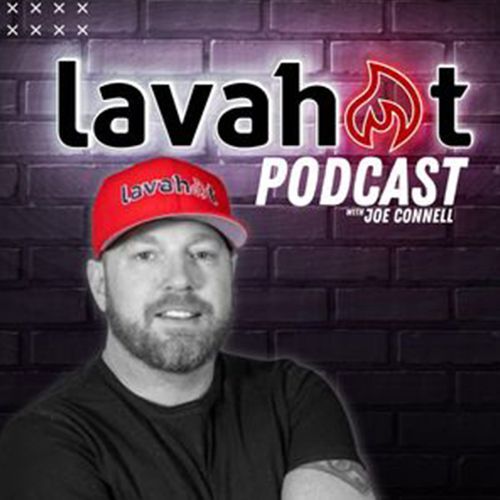 Joe Connell of the LavaHot Podcast in front of a brick wall; wearing a red hat and black shirt.
