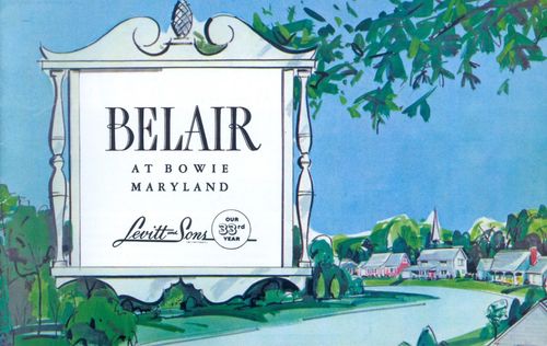 Belair at a tower, Maryland sign beside a tree-lined road and homes under a blue sky.