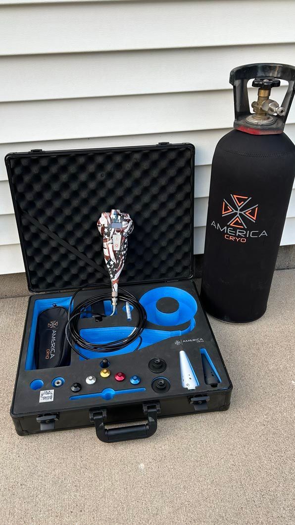 Black case with hookah kit and blue accessories beside a black gas cylinder on a porch.