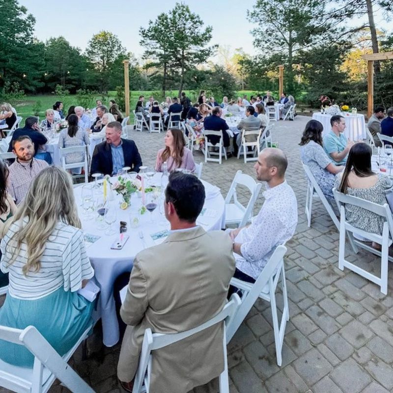 people sitting at round tables