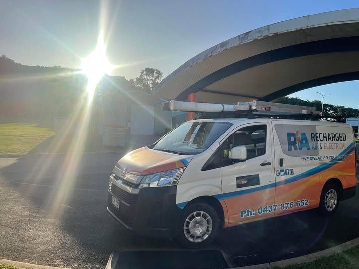 A Recharged Van Is Parked Under a Canopy in A Parking Lot — Recharged Air & Electrical in Innisfail, QLD
