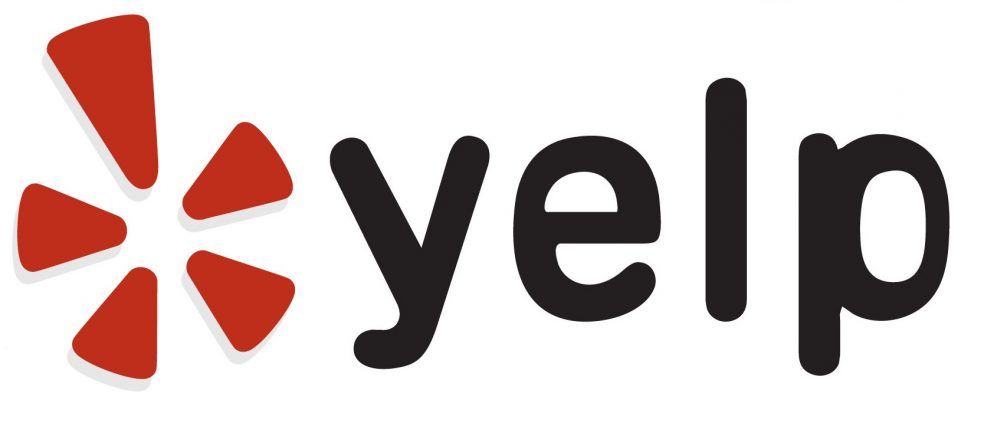 A yelp logo with a red star on a white background
