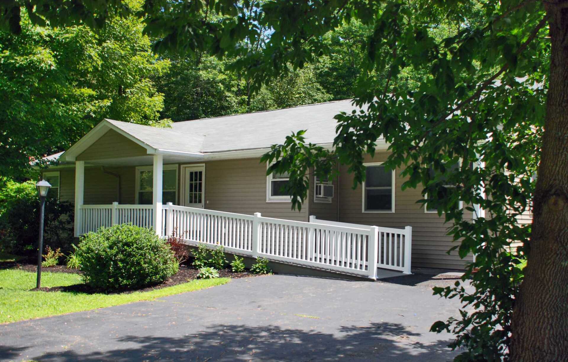 A house with a wheelchair ramp in front of it