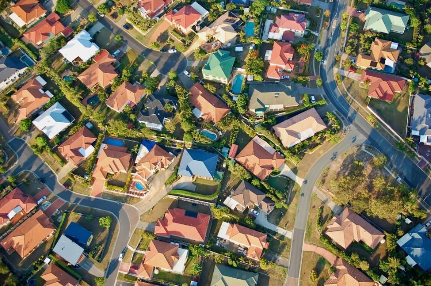 An Aerial View of a Residential Area With Lots of Houses and Trees — The Cool Guys In Palmerston, NT