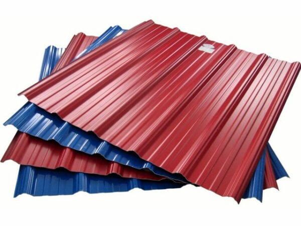 Red and blue corrugated metal roofing panels stacked.