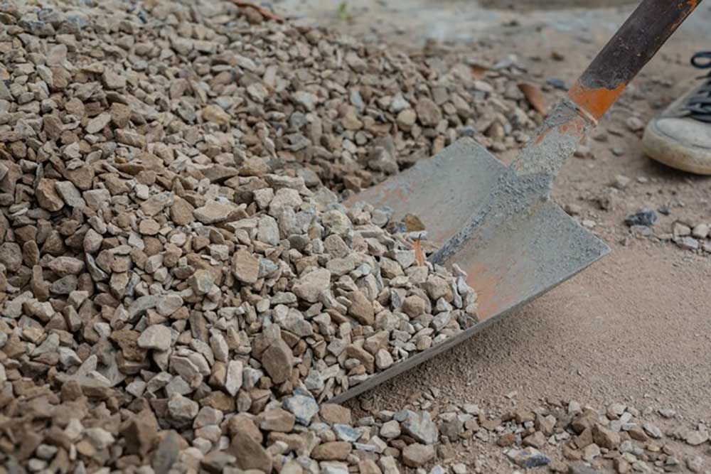 A Shovel Is Sitting On Top Of A Pile Of Gravel — Andrew Johnston Haulage In Lismore, NSW