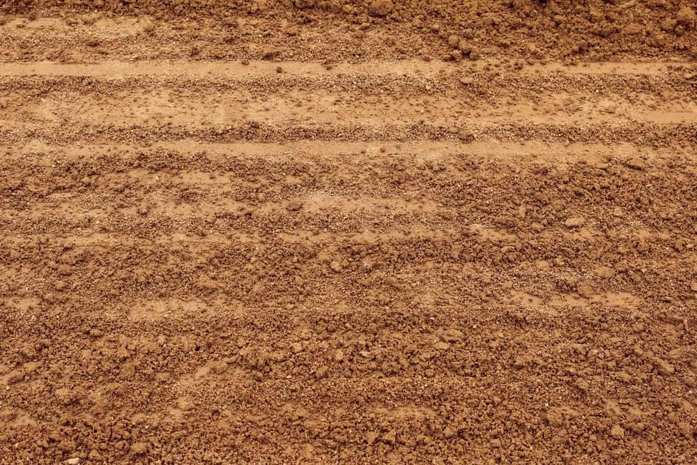 A Pile Of Brown Dirt With A Few Lines On It — Andrew Johnston Haulage In Tweed Heads, NSW