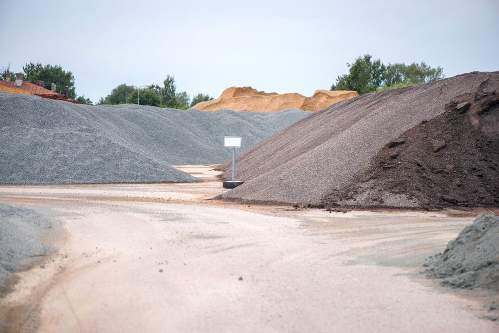 Piles Of Gravel And Dirt Are Stacked On Top Of Each Other — Andrew Johnston Haulage In Casino, NSW