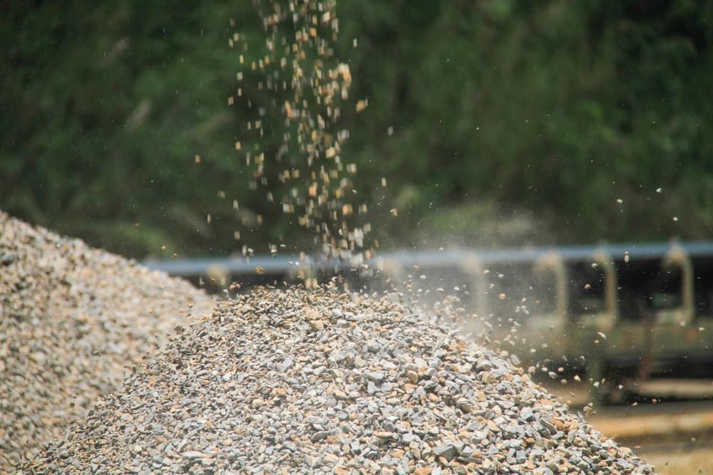 A Pile Of Gravel Is Being Poured Into A Pile — Andrew Johnston Haulage In Ballina, NSW