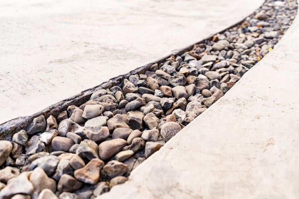 A Stream Of Rocks Is Running Through A Concrete Surface — Andrew Johnston Haulage In Grafton, NSW