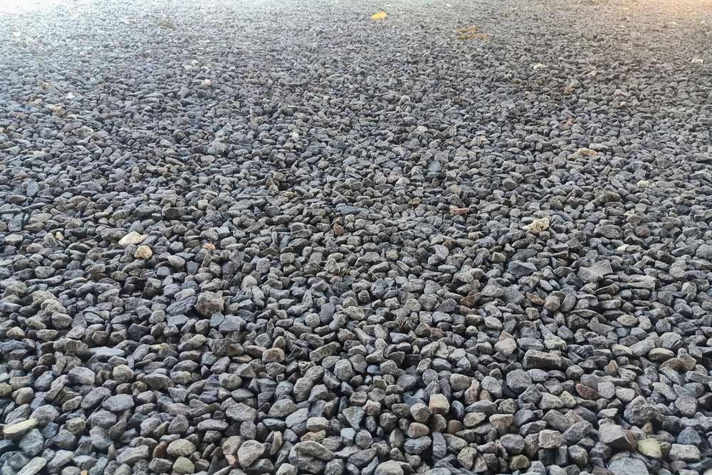 A Pile Of Gravel Is Sitting On The Ground — Andrew Johnston Haulage In Gold Coast, QLD