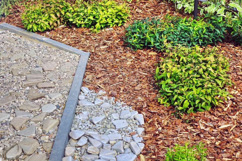 A Garden With Rocks, Mulch, and Plants — Andrew Johnston Haulage In Mullumbimby, NSW