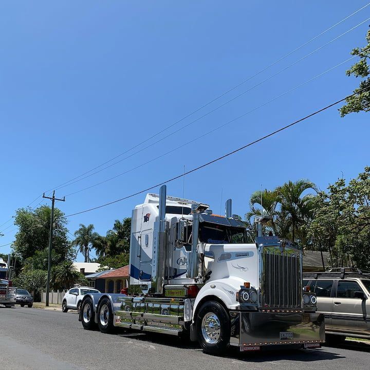 A Kenworth Semi Truck Is Parked On The Side Of The Road — Andrew Johnston Haulage In Ewingsdale, NSW