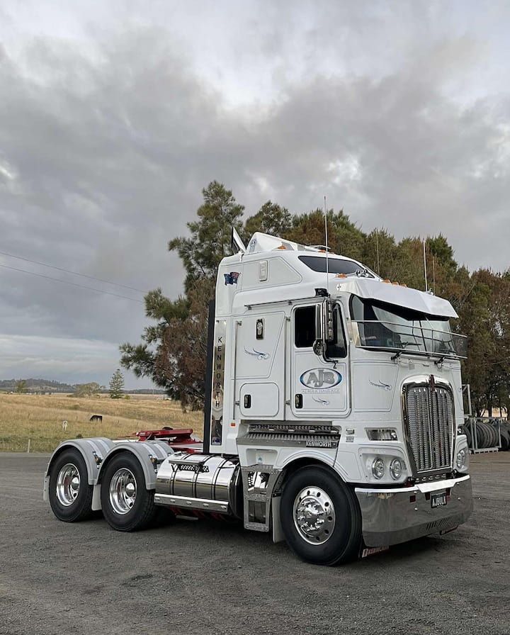 A White Semi Truck Is Parked In A Parking Lot — Andrew Johnston Haulage In Casino, NSW
