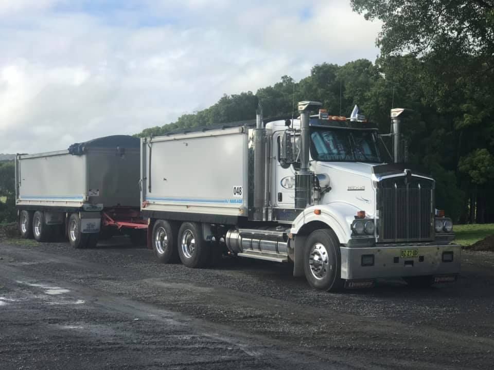 A Large Semi Truck is Parked in a Parking Lot — Andrew Johnston Haulage In Ewingsdale, NSW