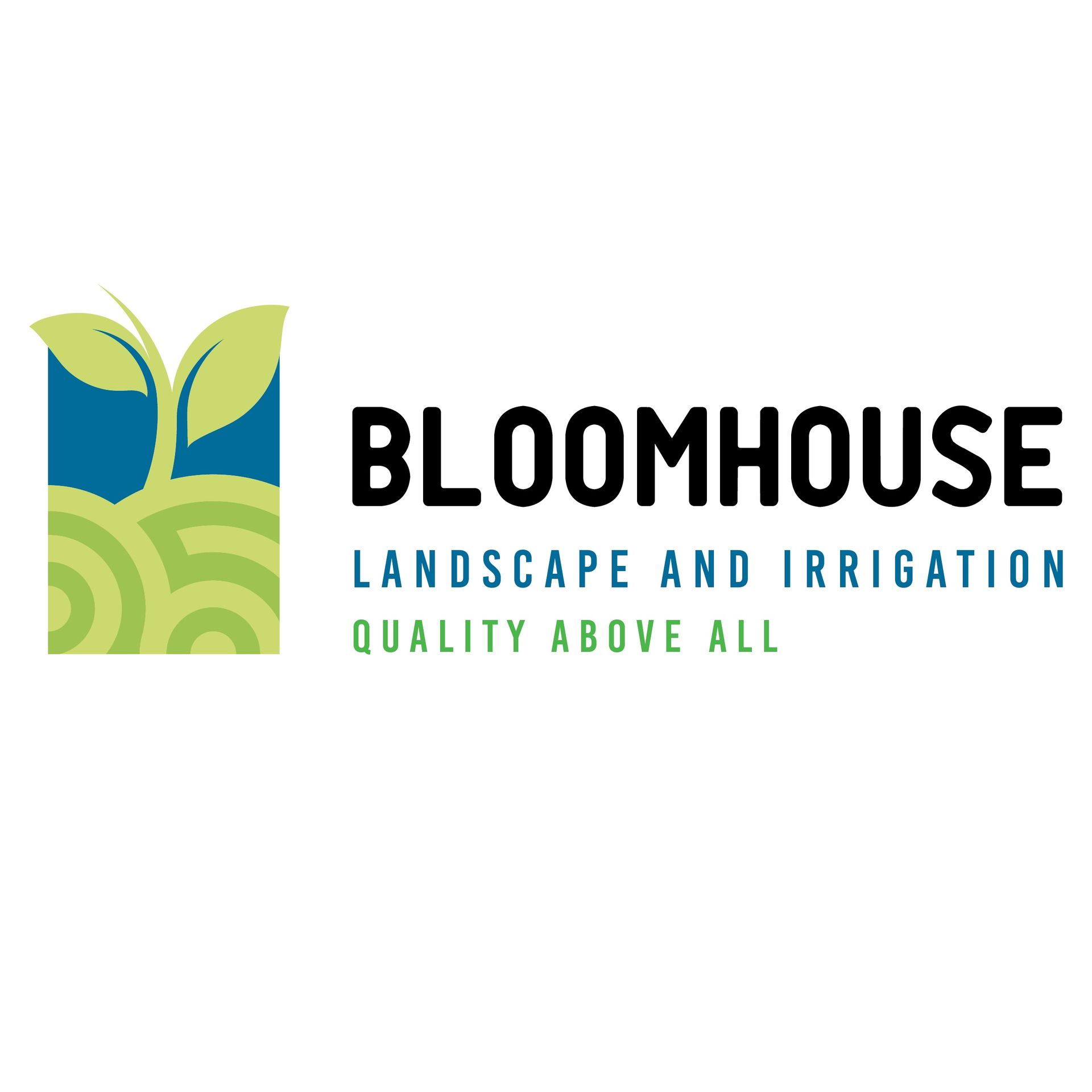 A person in a hat and green shirt uses a garden tool to work in a flower bed filled with red roses, tulips, and greenery.