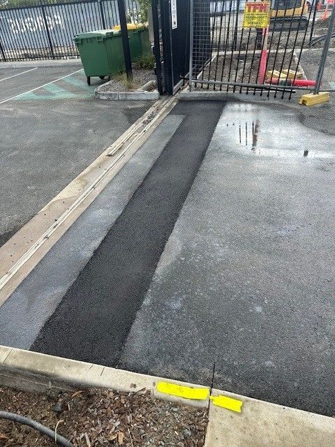 A Close Up Of A Trench Reinstatement On The Road — Elite Bitumen & Asphalt In Mackay, QLD