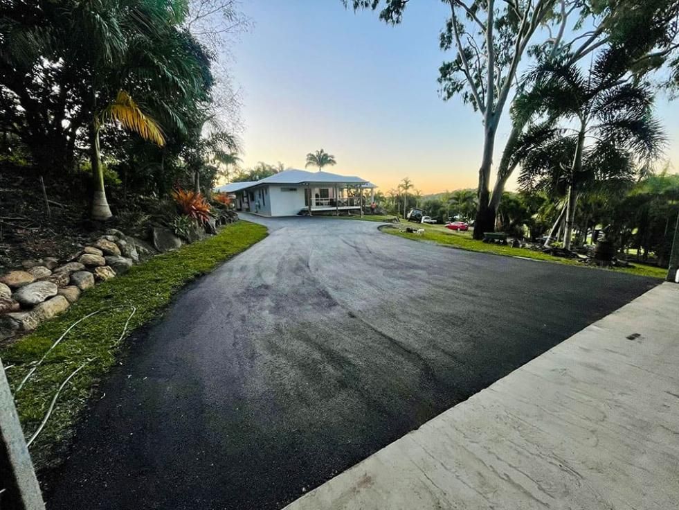 A Driveway Leading To A House Surrounded By Trees — Elite Bitumen & Asphalt In Mackay, QLD