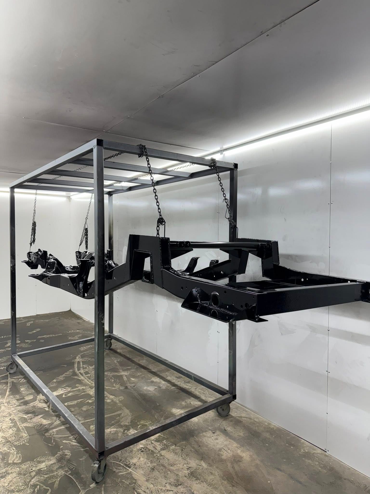 Whole vehicle frame powder coat