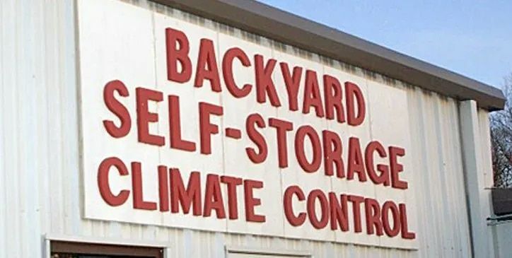 Sign on a white building: 