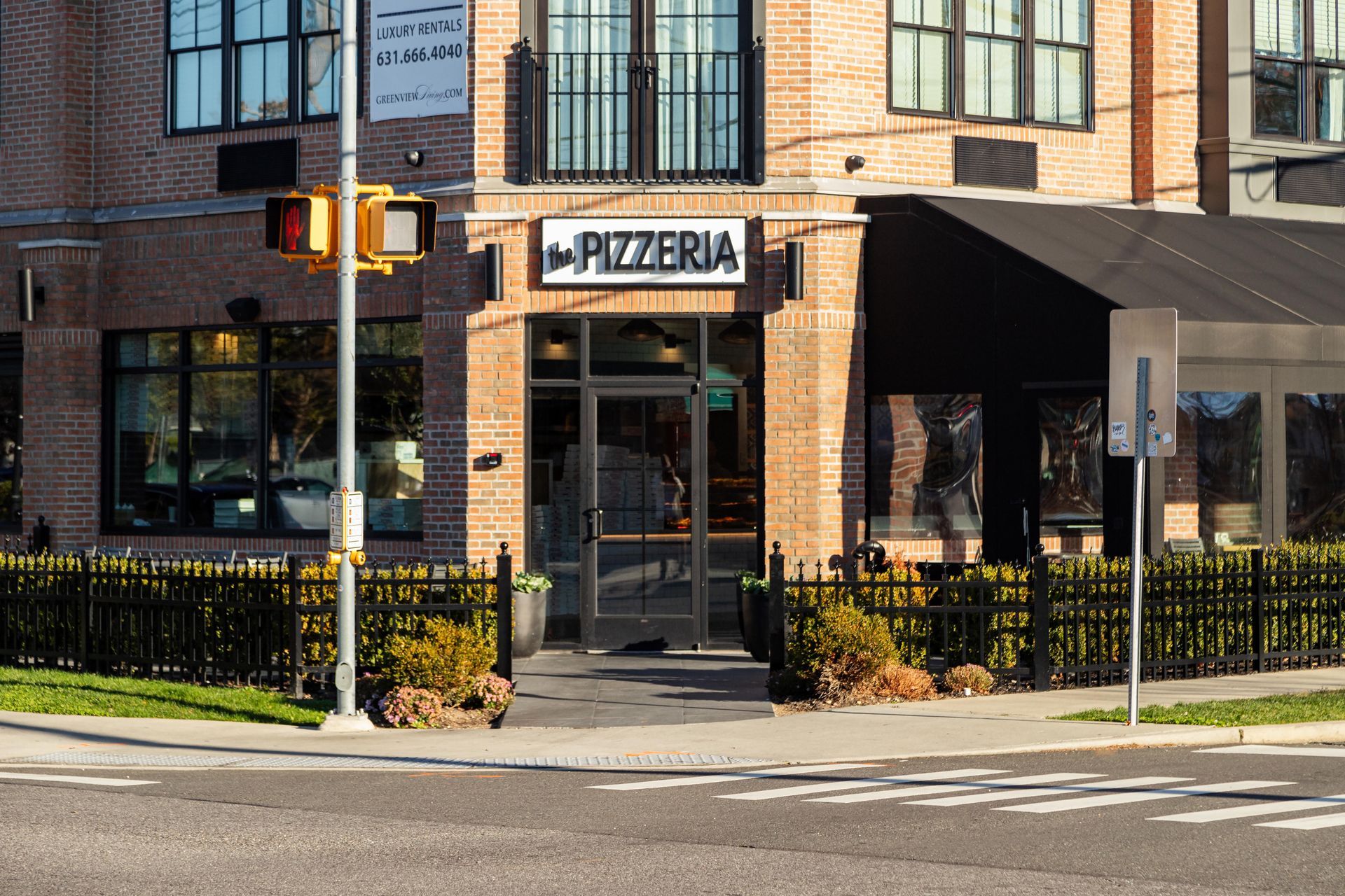 A restaurant with tables and chairs and a bar.