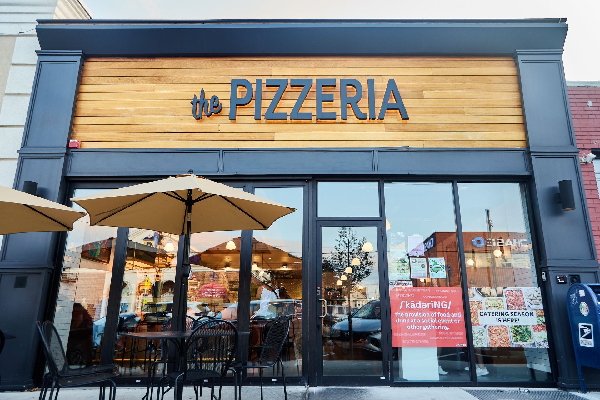 A pizzeria is located on the corner of a city street