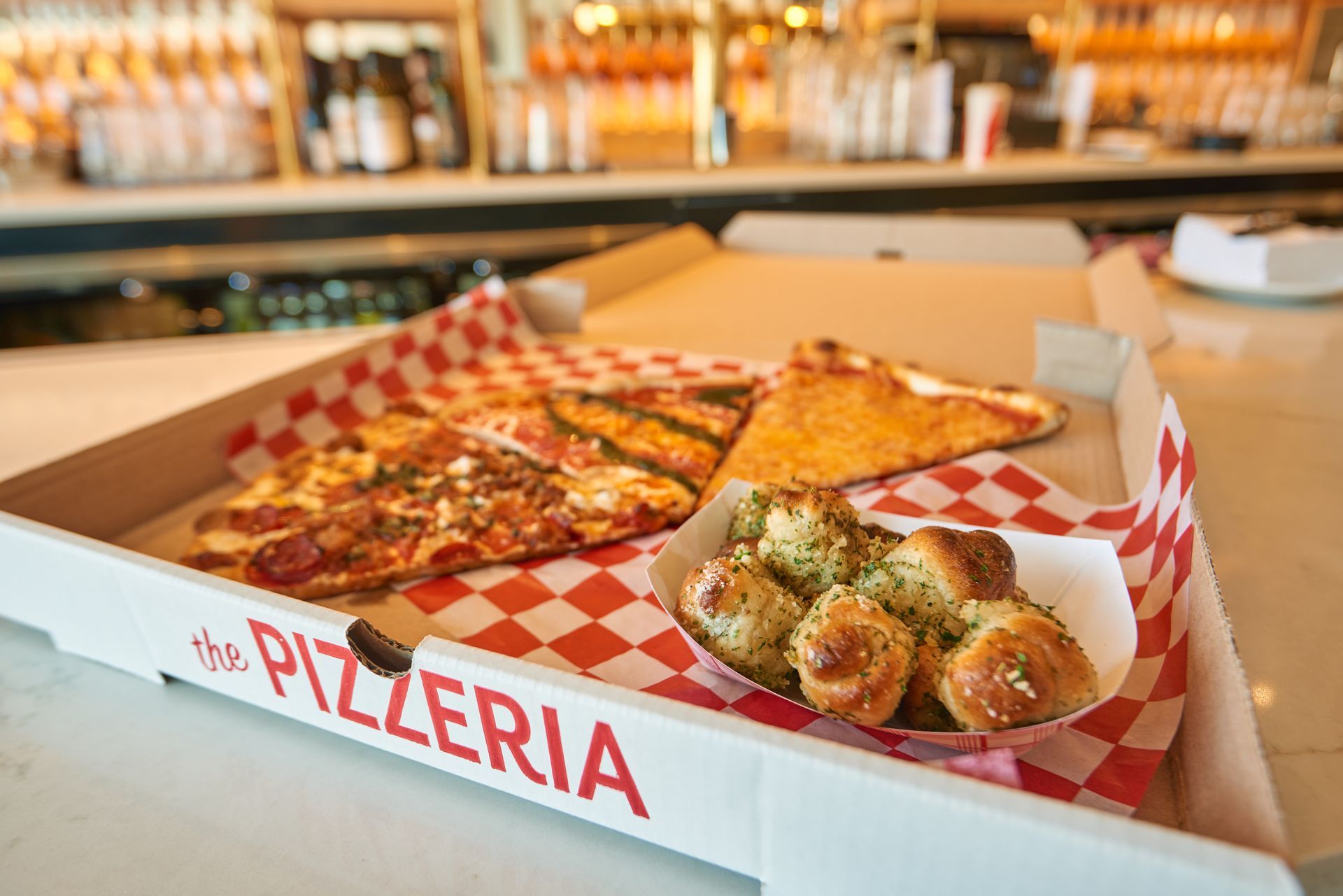 Enjoy fresh pizzas & Italian dishes at The Pizzeria.