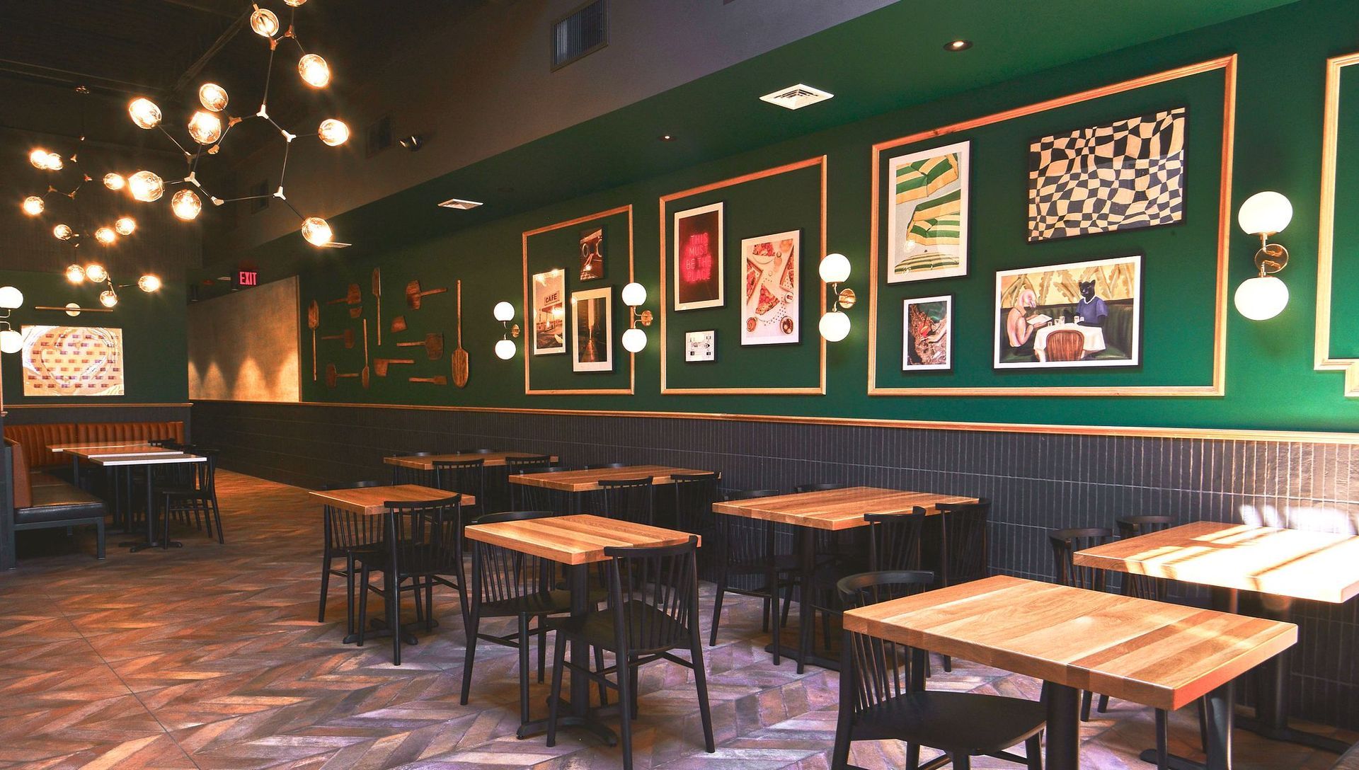 A restaurant with tables and chairs and a bar.