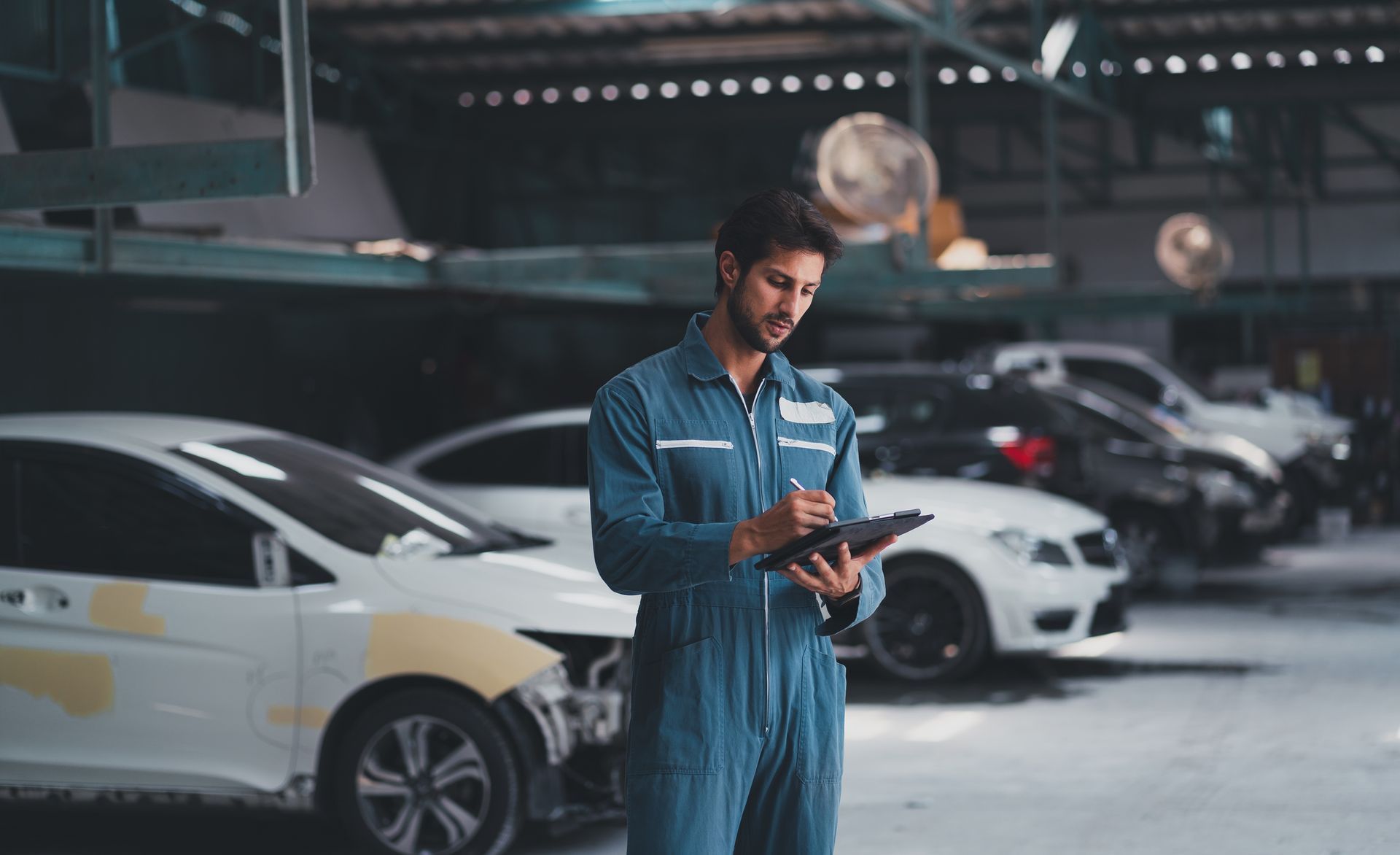 Mechanic Is Repairing A Car In The Garage — Santa Rosa, CA — Precision Frame and Body Shop