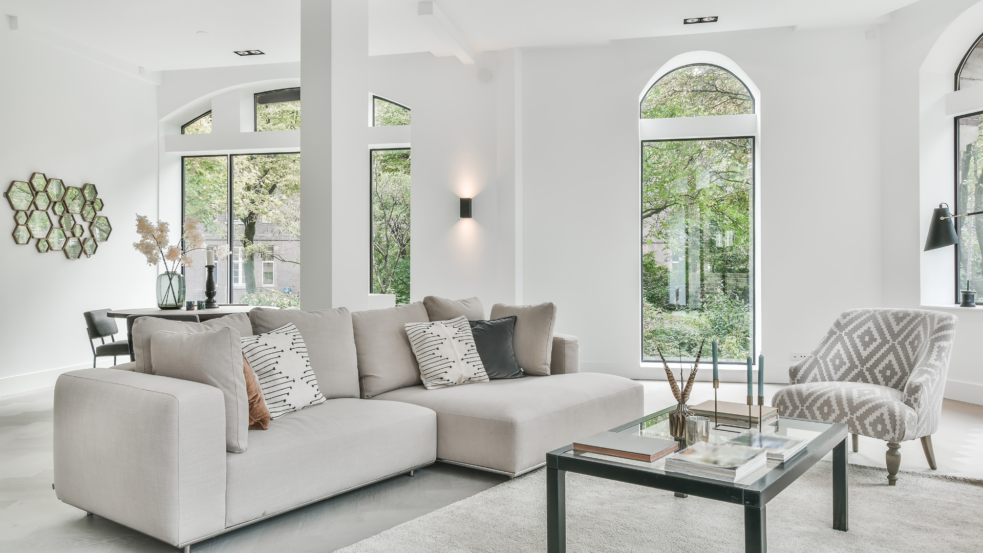 A living room with a couch , chair and coffee table