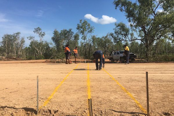 A Group Of People Are Working On A Dirt Road With Markings — Coleman's Contracting & Earthmoving In Humpty Doo, NT