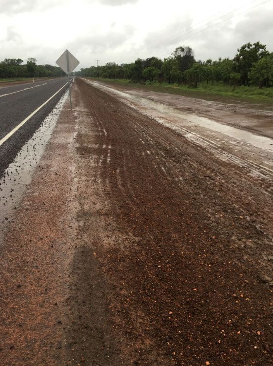 A Muddy Road Besides A Newly Constructed Road — Coleman's Contracting & Earthmoving In Katherine, NT