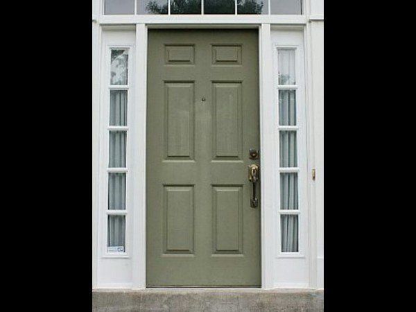 An olive green, six-panel front door with sidelight windows and white trim.