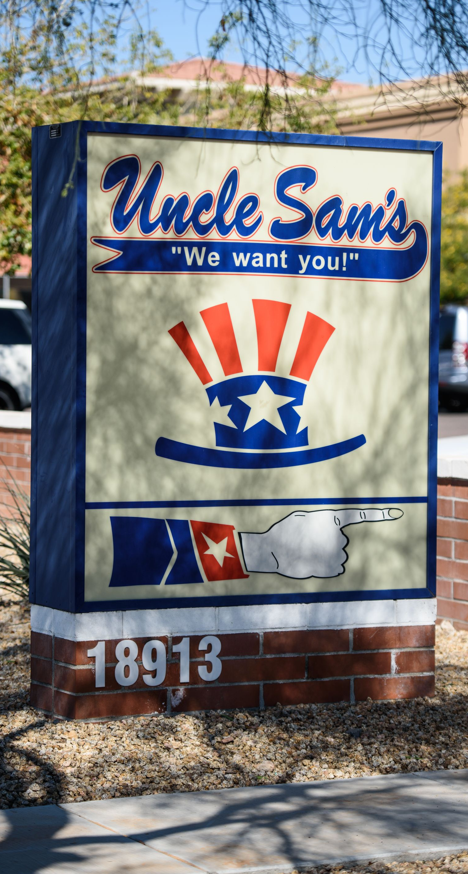 Uncle Sams restaurant sign with red, white, and blue patriotic design and address number 18913