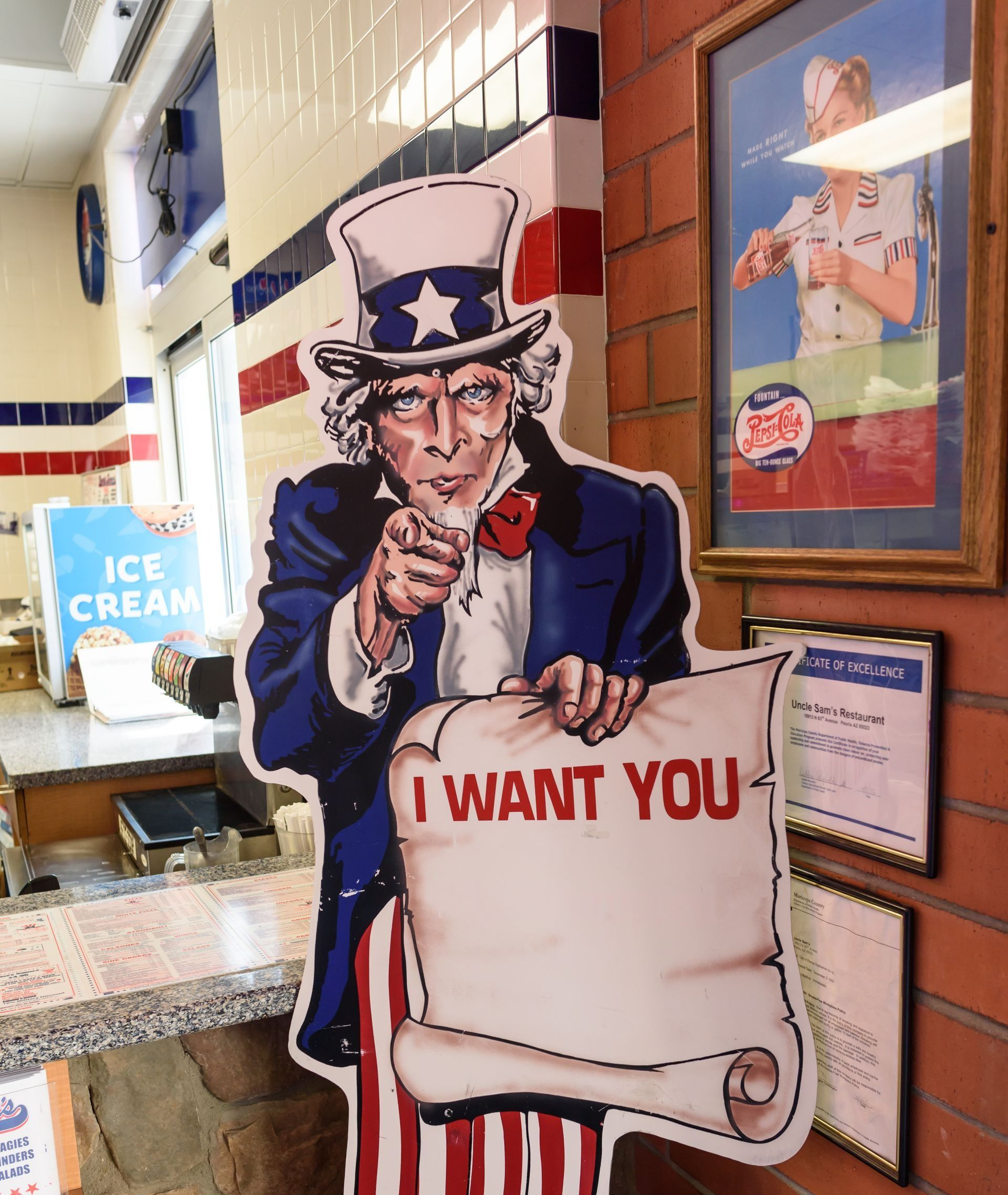 Uncle Sam “I WANT YOU” cardboard cutout inside an ice cream shop