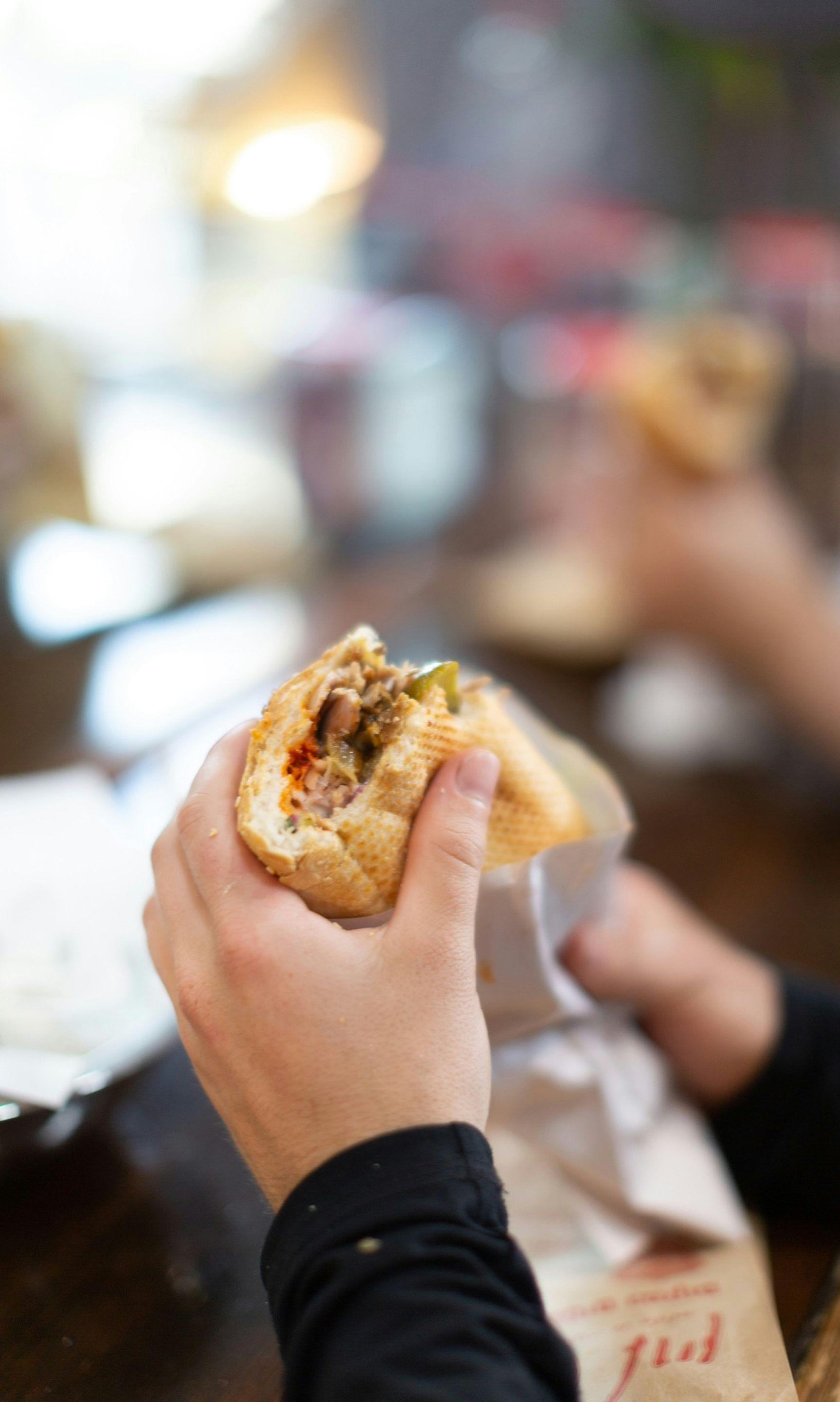 person eating a sandwich