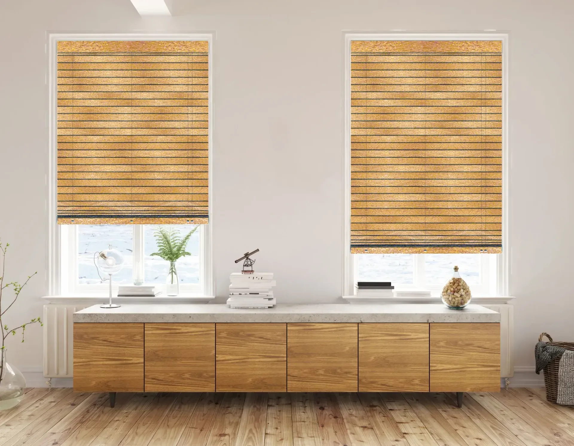 Two windows with brown Roman shades above a wooden cabinet in a room.