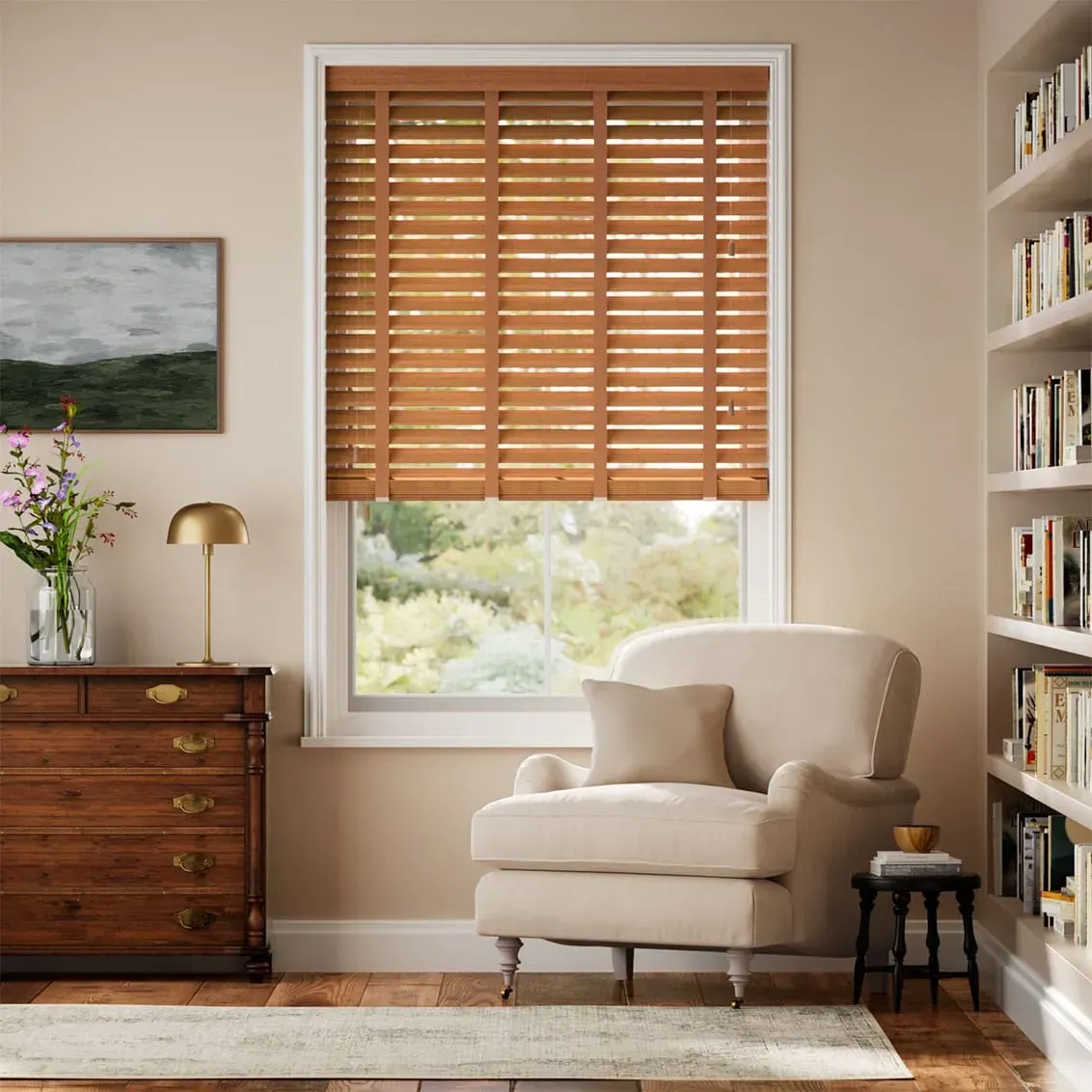 Room interior with wooden blinds, armchair, bookshelf, chest of drawers, and window overlooking trees.