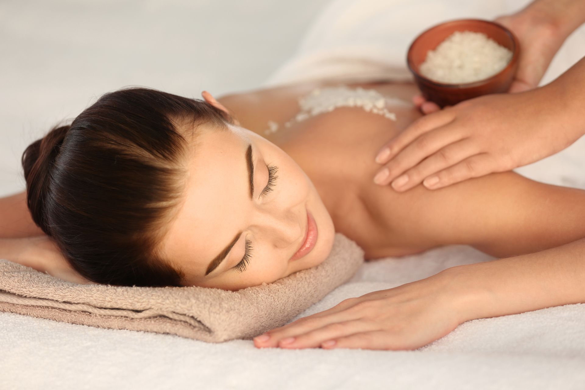 A woman is getting a massage at a spa.