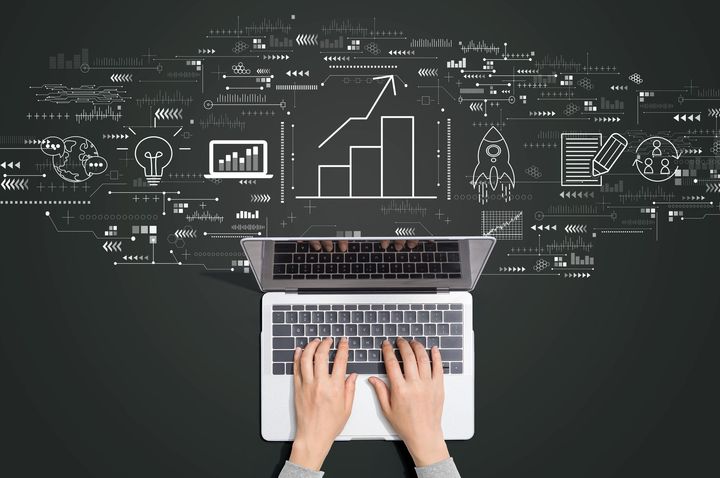 image of laptop and with hands typing