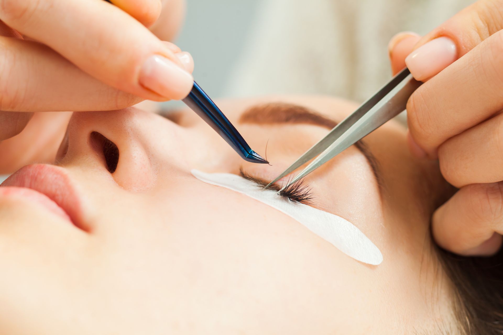 a woman getting her lashes done