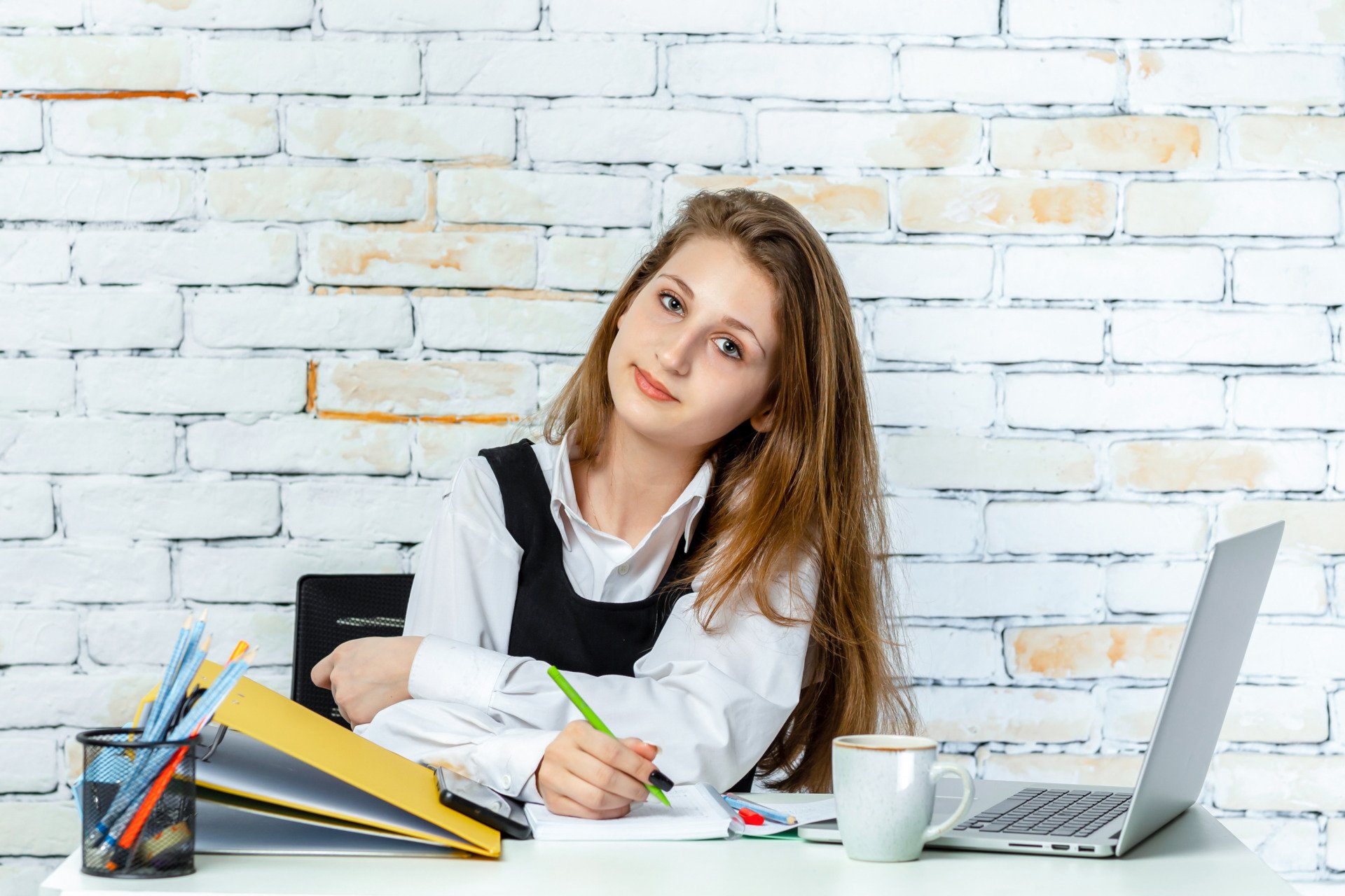 a woman busy with schoolwork