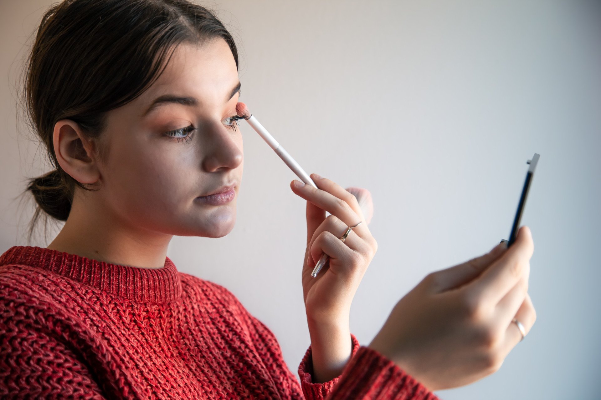 woman applying eye shadow